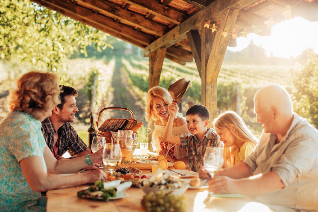 Mutligenational family enjoying dinner, life insurance